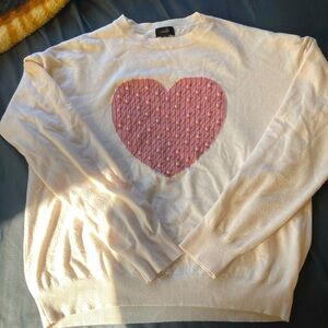 Extra large cream colored sweater from Ontwelfth with large textured heart.